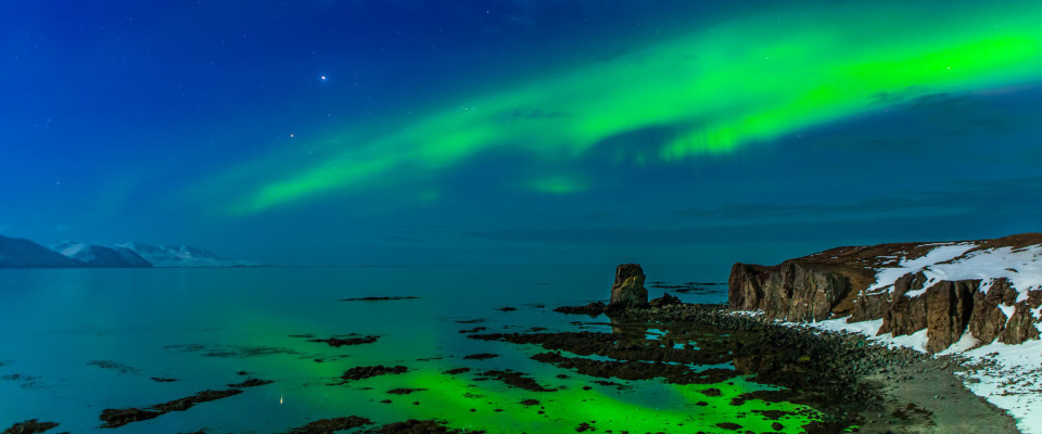 Aurora Borealis above Bakkahöfði, two kilometers north of Húsavík © Gaukur Hjartarson